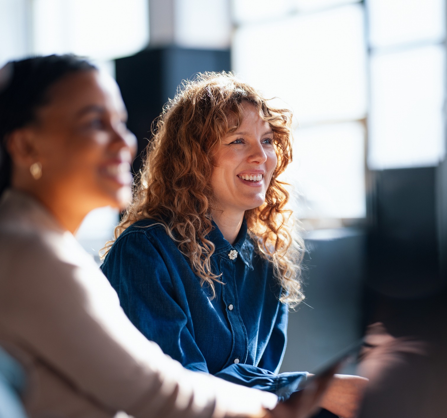 Team members smiling in a meeting